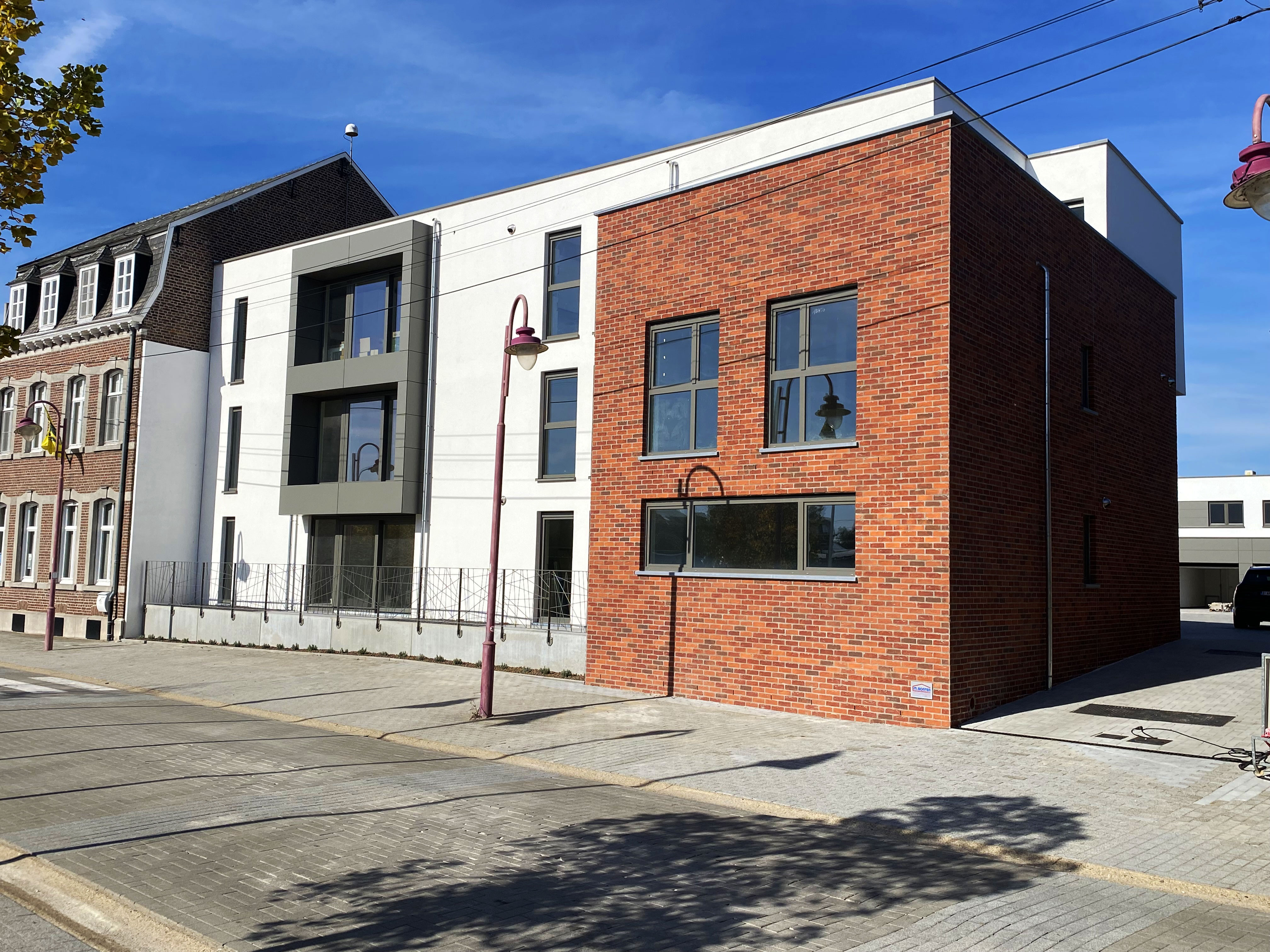 Beeld van een wooncomplex van 6 appartementen en 5 woongelegenheden - Plein in Moelingen
